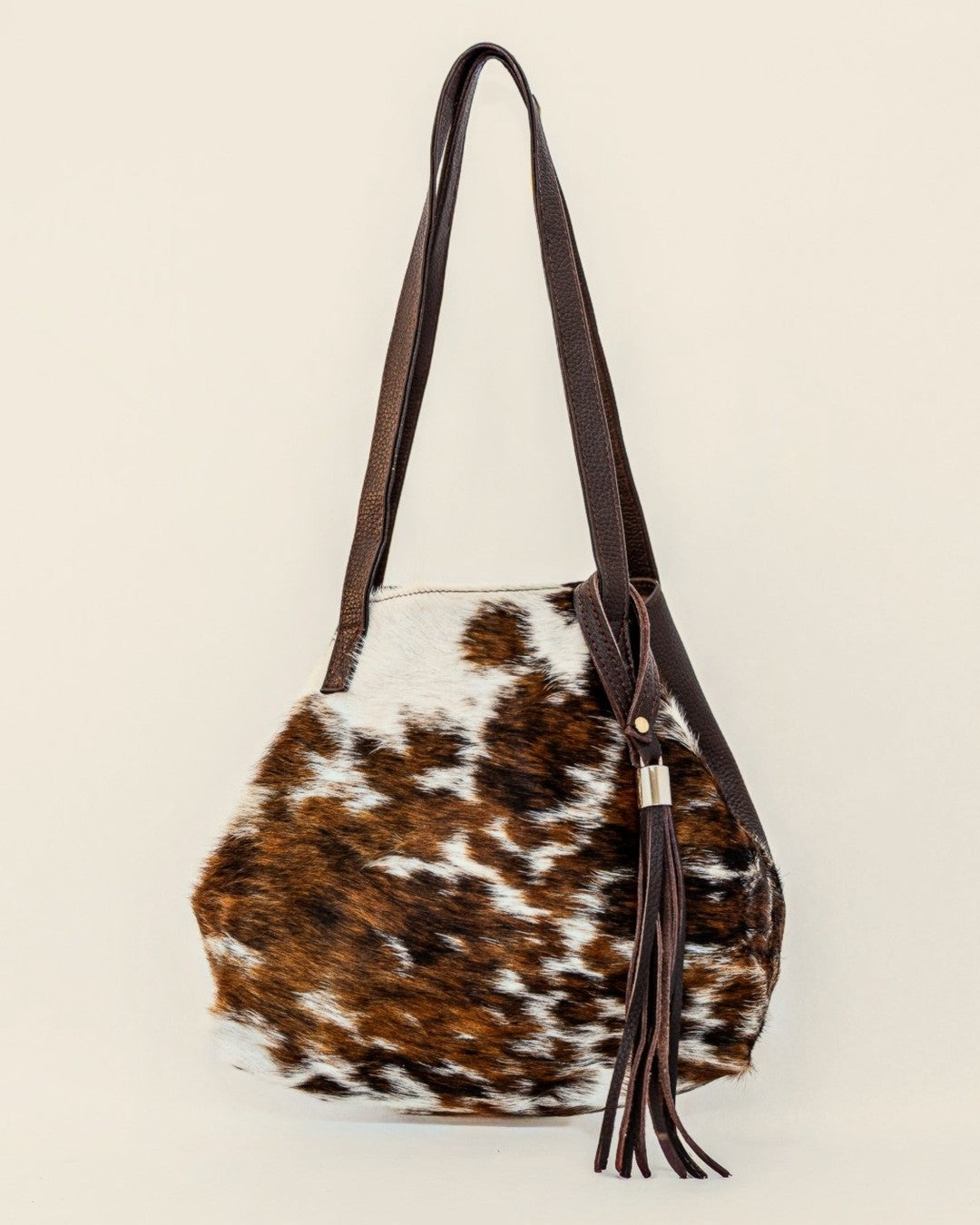 Atlantica Hair-on-Hide Tote — brown and white hide clipped into mini bucket shape | Sangre de Mar handcrafted leather