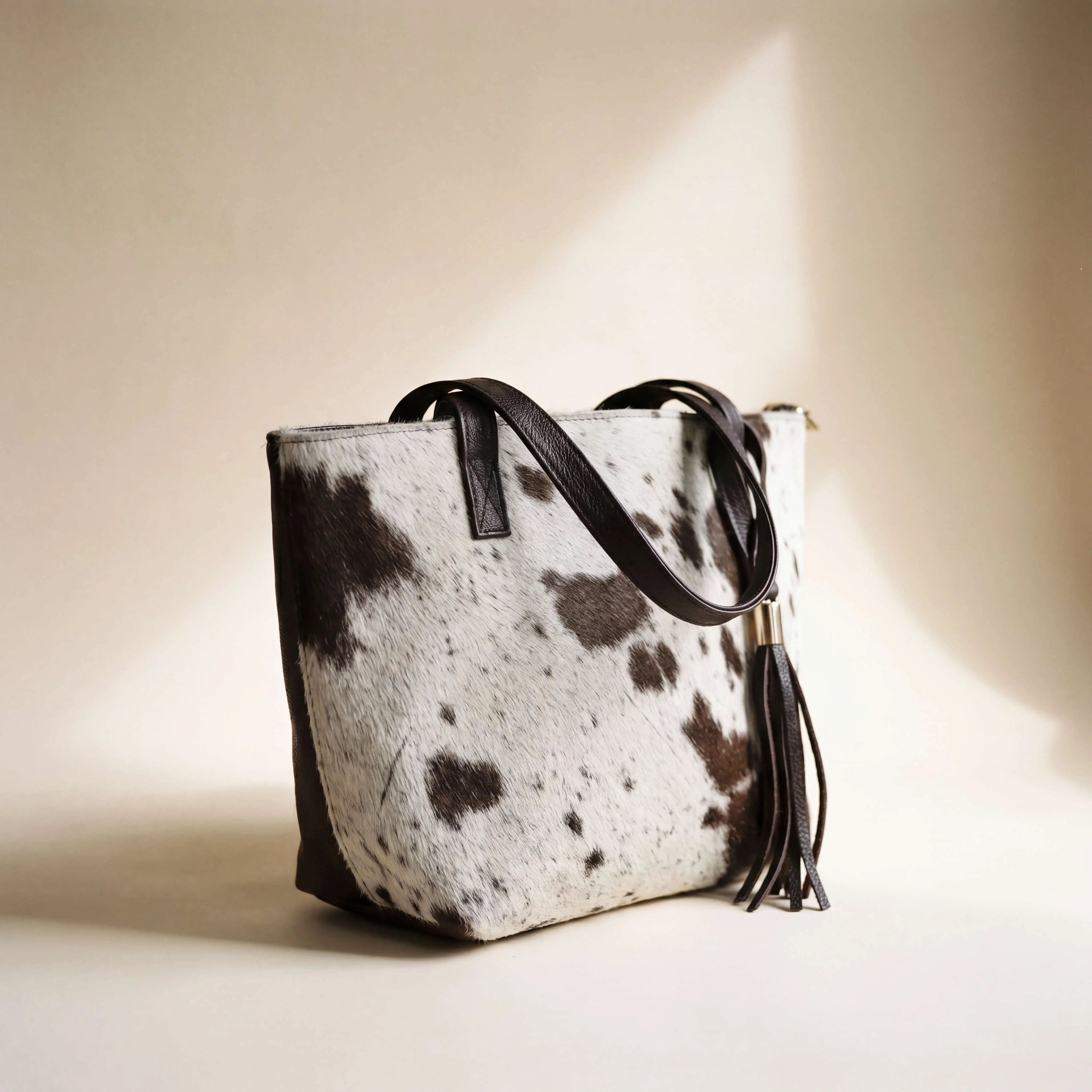 Full-grain brown leather back panel of the Sangre de Mar Atlantica hair-on-hide tote
