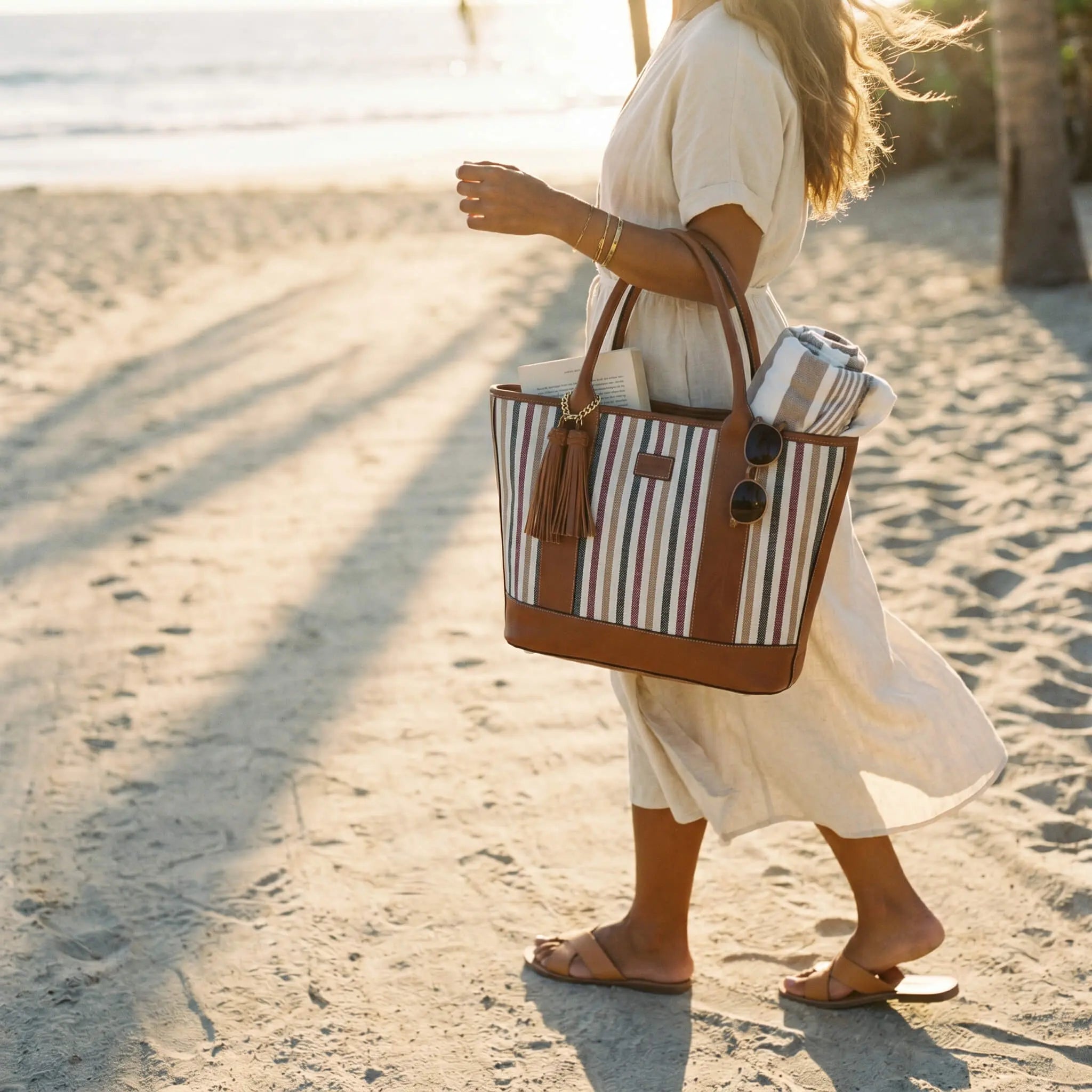 Riviera Carryall Tote — multicolour striped canvas & tan leather — front view with tassel | Sangre de Mar handcrafted leather