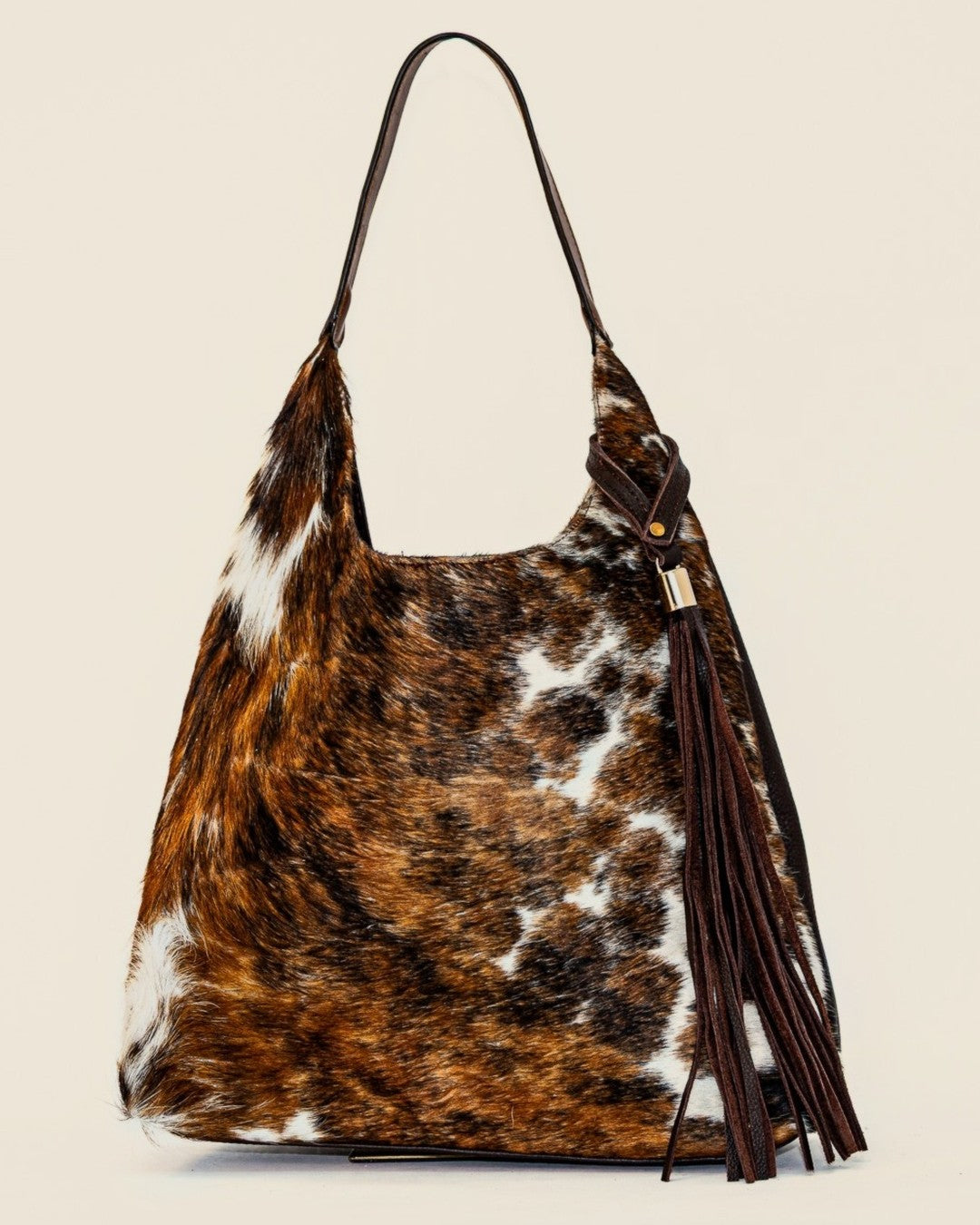 Sienna Tote — brown hair-on-hide with leather tassel — front view | Sangre de Mar handcrafted leather