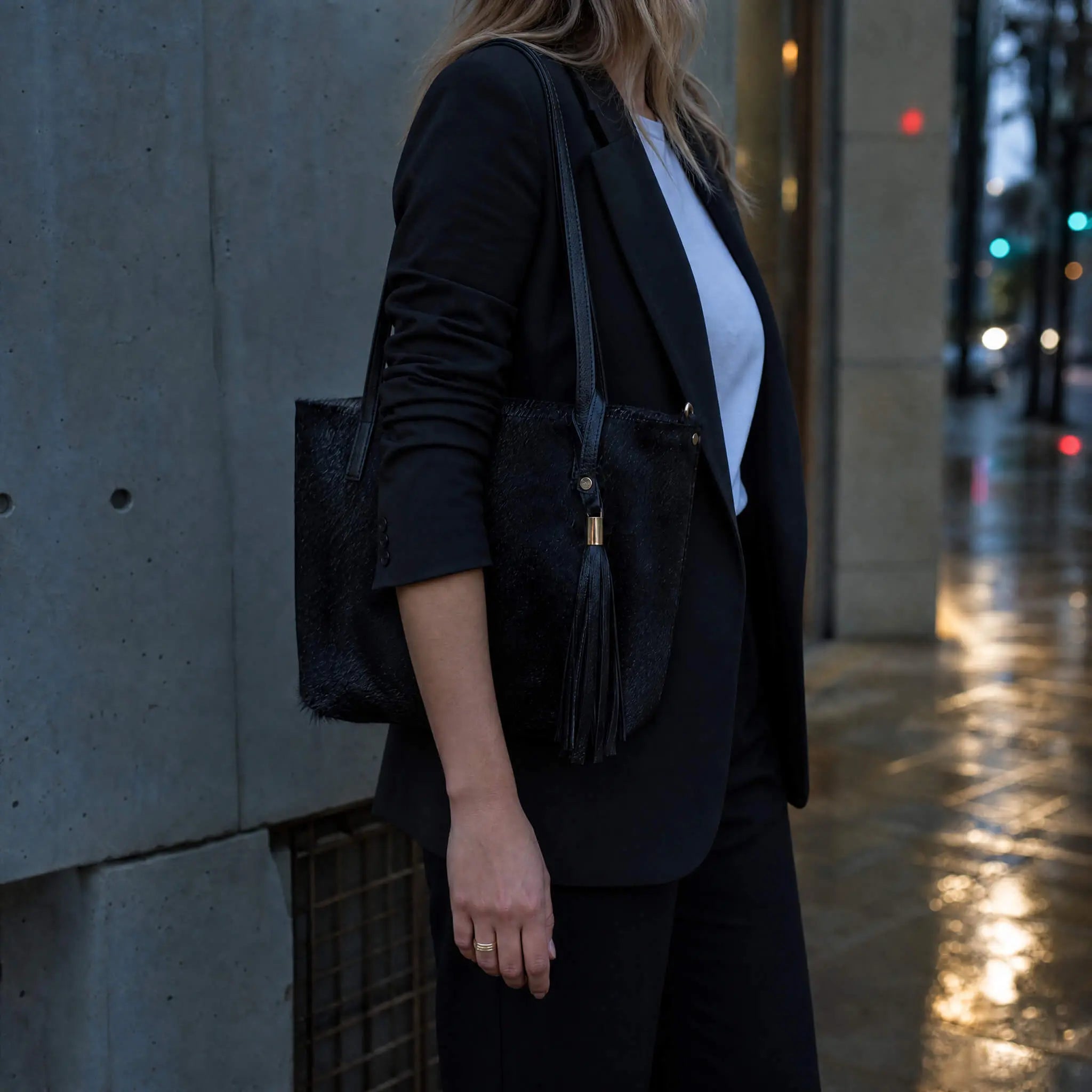 Sangre de Mar Atlantica hair-on-hide tote in black with leather straps and tassel
