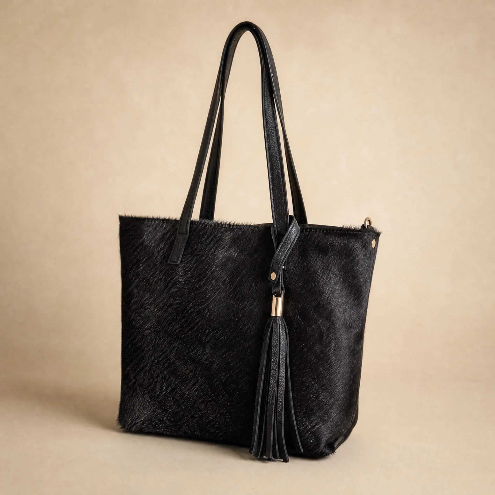 Full-grain black leather back panel of the Sangre de Mar Atlantica hair-on-hide tote