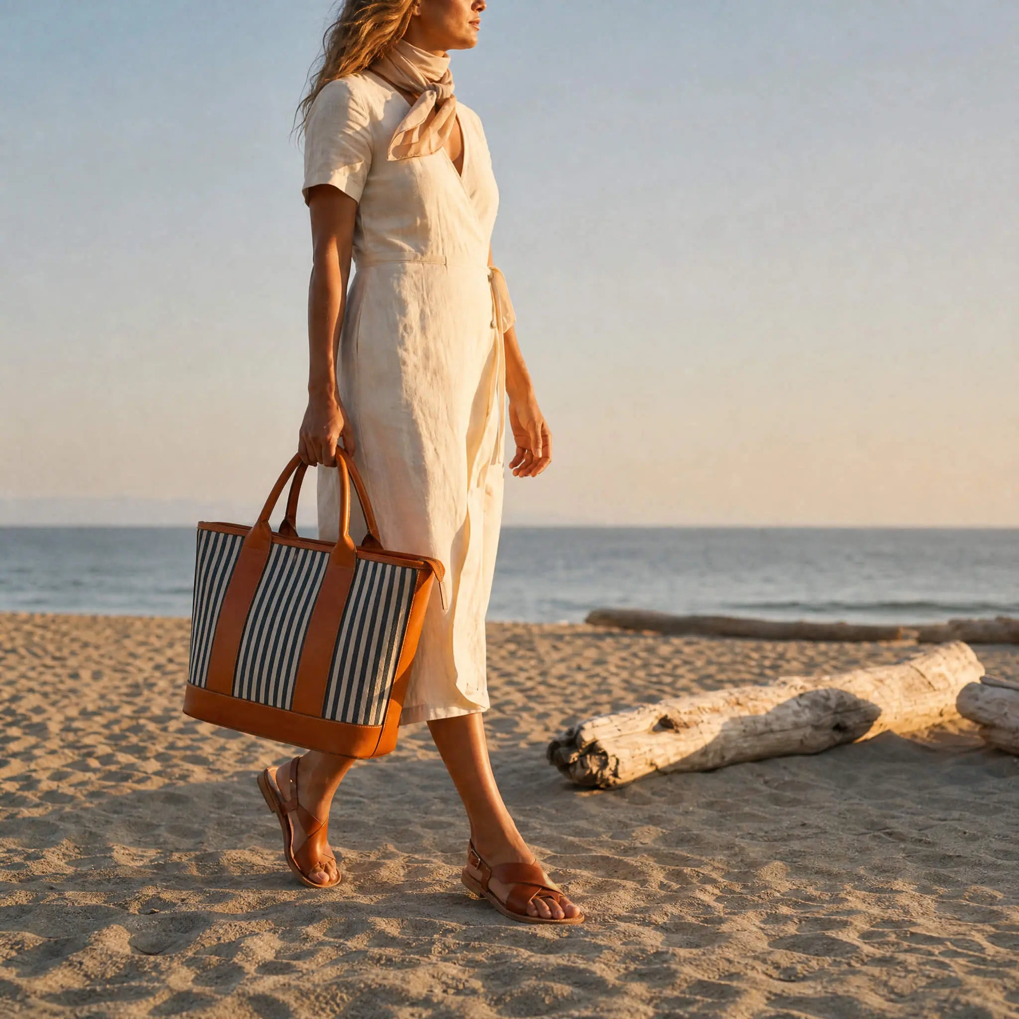 Riviera Carryall Tote — striped canvas & tan leather — worn at the beach | Sangre de Mar handcrafted leather
